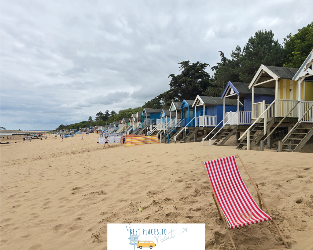 Colourful beach huts lining the sandy beach at Wells-next-the-Sea in Norfolk